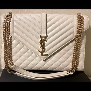 Gently used. No box or receipt. Does come with dust bag cover. LARGE Ivory/Gold.